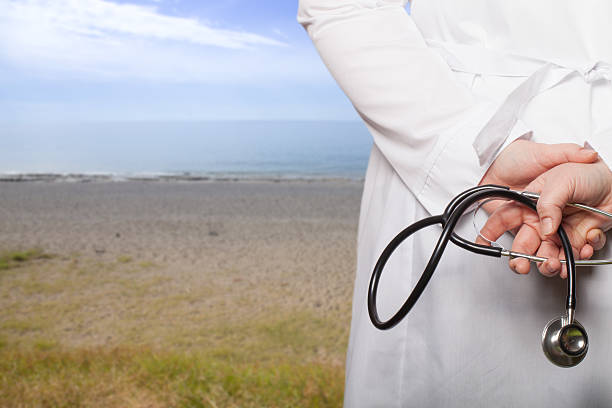 istock The doctor put his hands with stethoscope behind his back 615425450