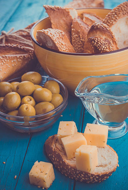 istock Ingredients for sandwich with cheese, baguette and olives 615425668