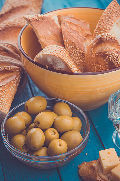 istock Ingredients for sandwich with cheese, baguette and olives 615425702