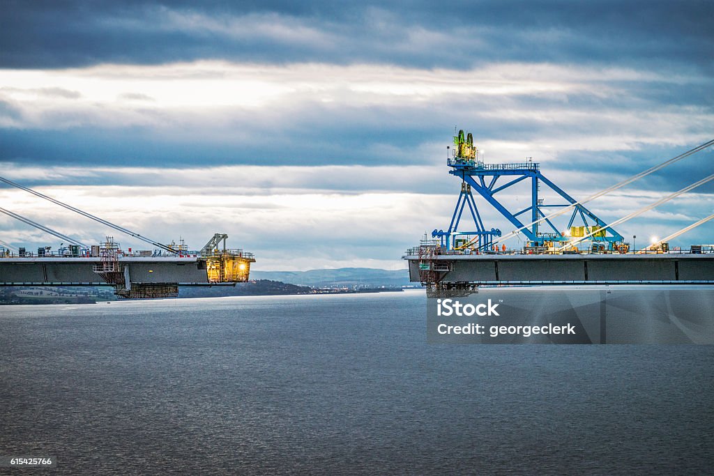 Approaching final connection of the Queensferry Crossing over th Construction nearing completion on the new bridge over the Firth of Forth between Fife and the Lothians. Bridge - Built Structure Stock Photo