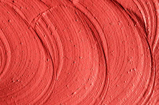 Photo of Red moroccan cosmetic clay texture close up.