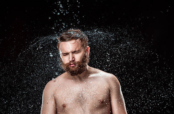 istock The water splash on male face 615426182