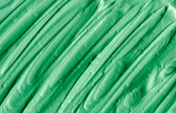 istock Green cosmetic clay texture close up. 615426400