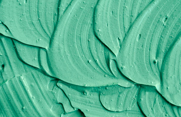 istock Green cosmetic clay texture close up. 615426442