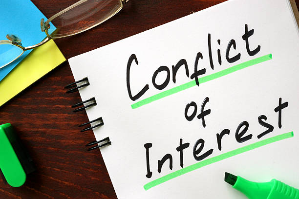 Conflict of interest sign written in a notepad. Conflict of interest sign written in a notepad. curiosity stock pictures, royalty-free photos & images