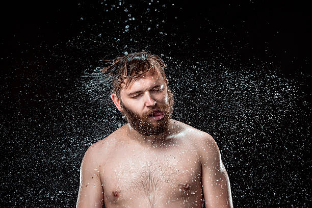istock The water splash on male face 615426714