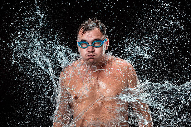 istock The water splash on male face 615426914