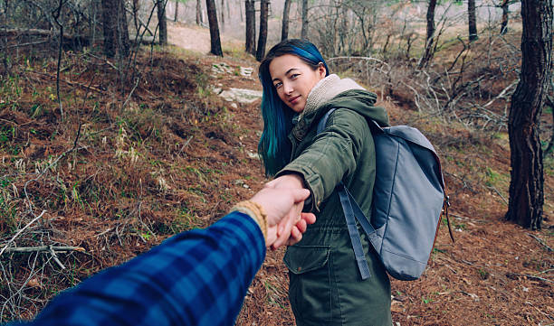 istock Couple walking in the forest 615427042