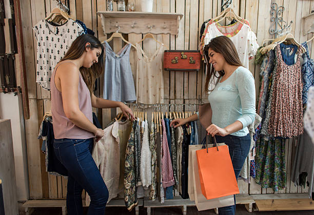 istock Happy women shopping 615428100