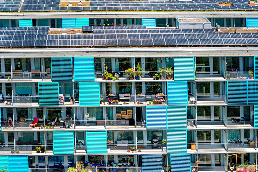 Zurich, Switzerland - June 28, 2016: Modern residential building's facade with solar panels in Oerlikon district in Zurich in Switzerland