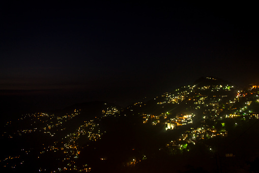 Shimla city during at dusk, shot from the ridge.