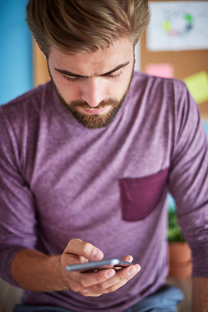 istock Close up of man with mobilephone 615429404