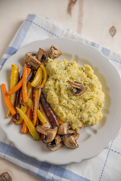 istock Creamy polenta with roasted vegetables 615429860