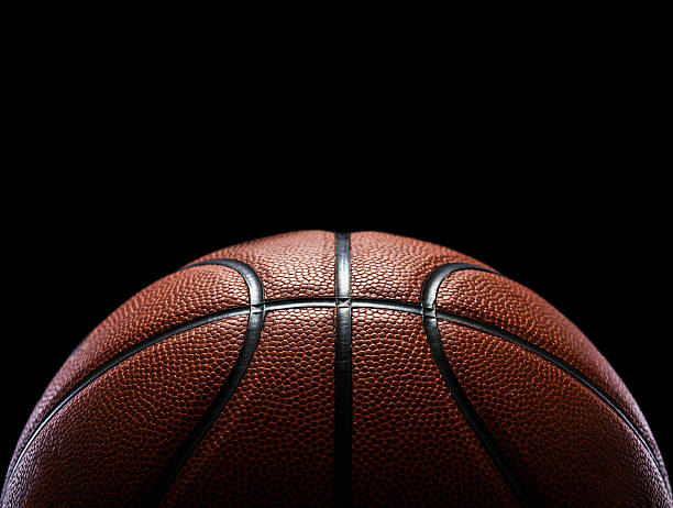 basketball isoliert auf schwarz - märz fotos stock-fotos und bilder