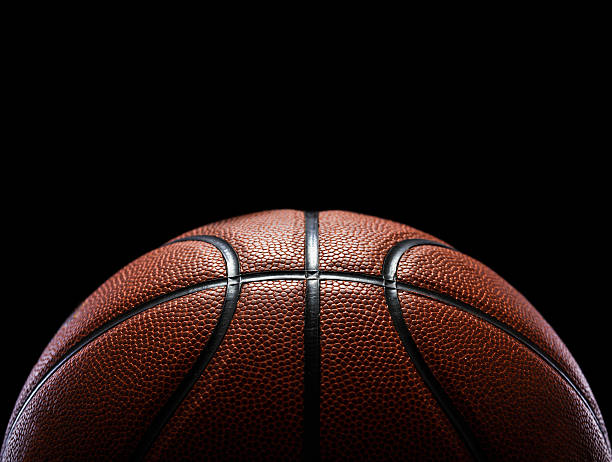 istock basketball isolated on black 615429908