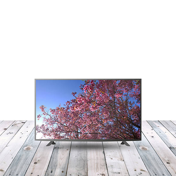 istock modern monitor LCD on wooden table with white copy space 615479934