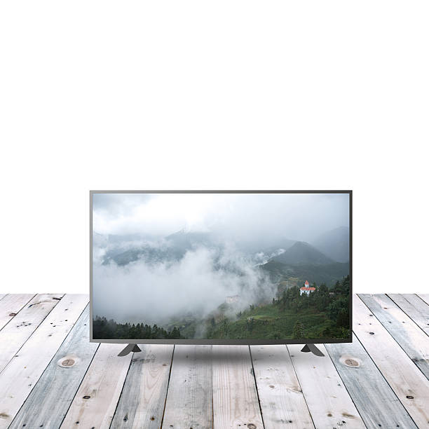 istock modern monitor LCD on wooden table with white copy space 615479950