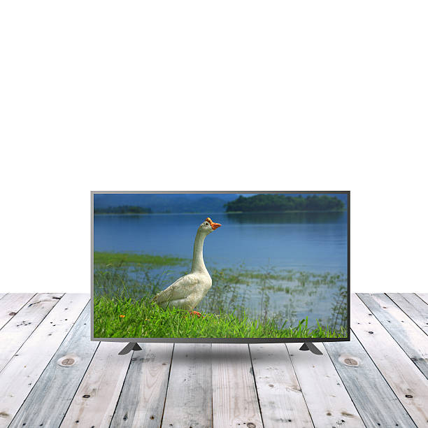 istock modern monitor LCD on wooden table with white copy space 615479954
