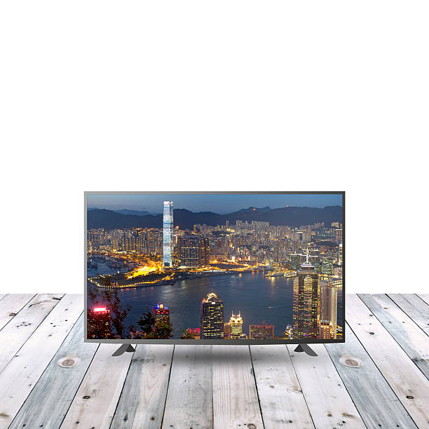 istock modern monitor LCD on wooden table with white copy space 615480120