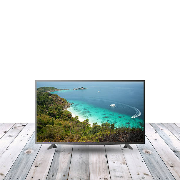 istock modern monitor LCD on wooden table with white copy space 615480122
