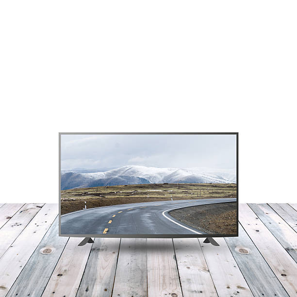 istock modern monitor LCD on wooden table with white copy space 615480132