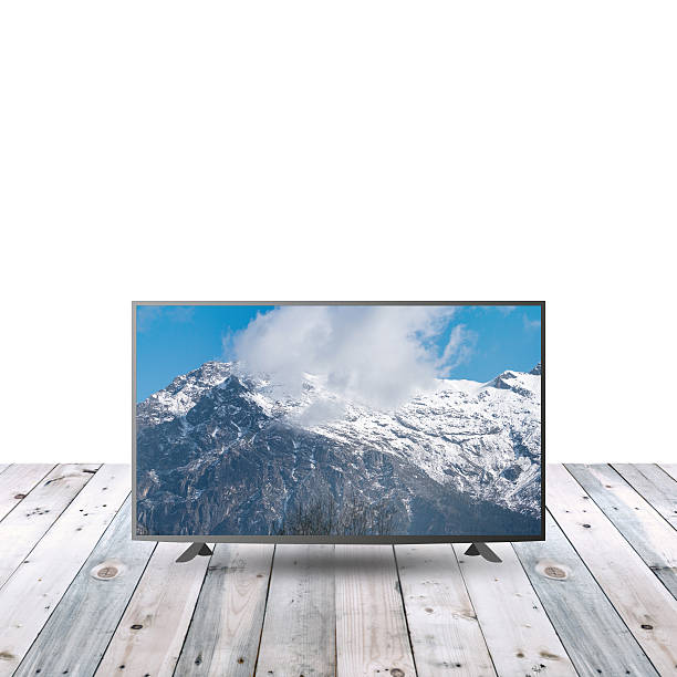 istock modern monitor LCD on wooden table with white copy space 615480150