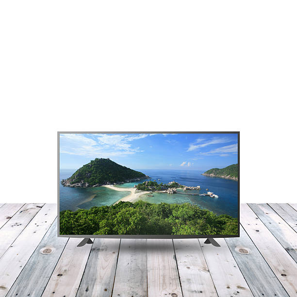 istock modern monitor LCD on wooden table with white copy space 615480164