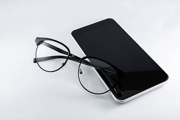 istock Glasses and smartphone on white background. 615480334