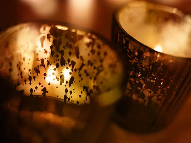 Two candle lights in a glass for a solemn occasion