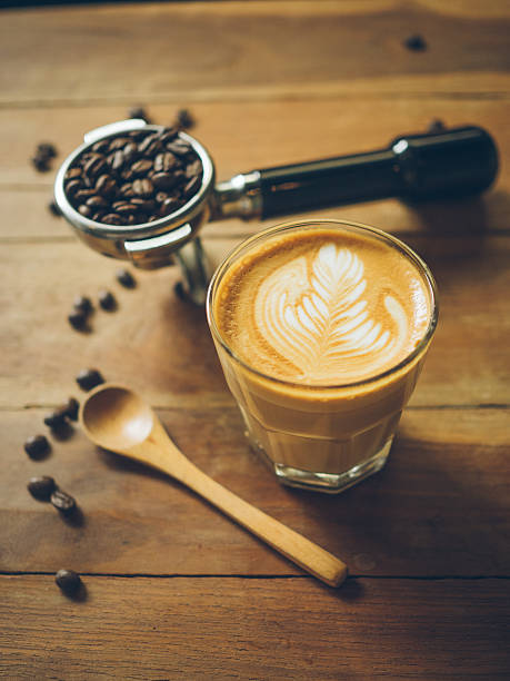 istock cup of coffee latte on the wood texture 615483686