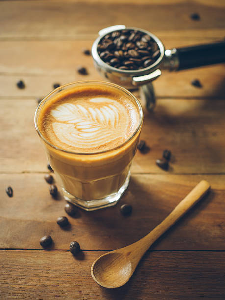 istock cup of coffee latte on the wood texture 615483792