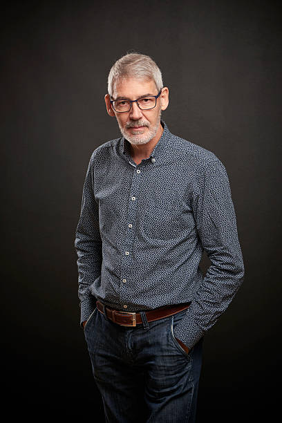 istock Calm looking man with beard and glasses 615485976