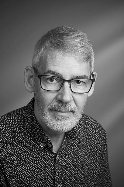 istock Calm looking man with beard and glasses close up 615486210