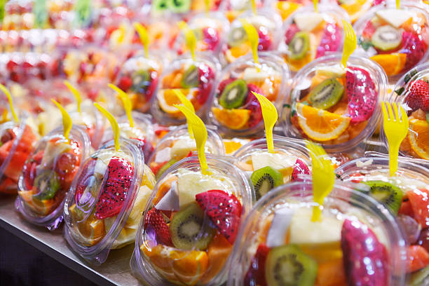 istock Fruit Salad arranged in plastic cups on a market 615487334