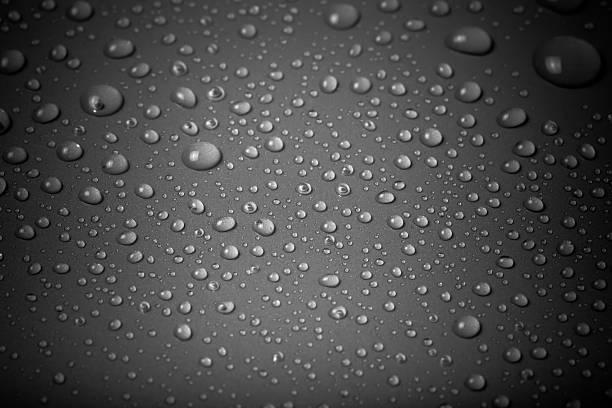 istock Drops of water on a color background. Gray 615487548