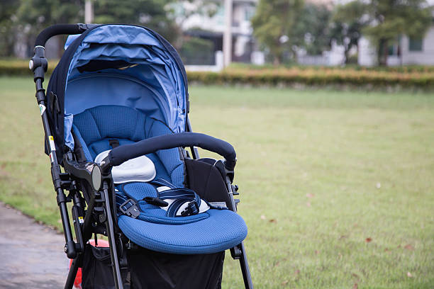 stroller carriage for baby in the garden stroller carriage for baby in the garden baby stroller stock pictures, royalty-free photos & images