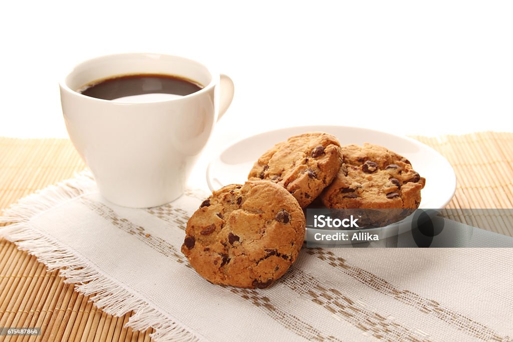Chocolate cookies and a cup of coffee Close-up of round chocolate biscuits and a cup of coffee Baked Stock Photo
