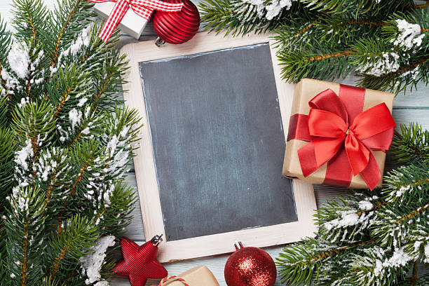 istock Christmas chalkboard, decor and fir tree 615488560