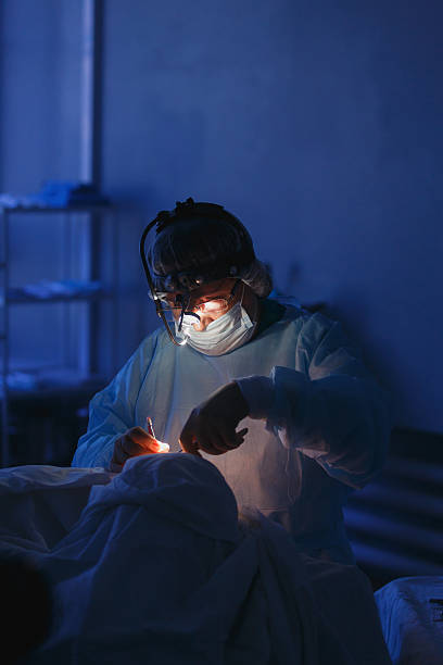 istock Real Surgeon working and holding surgical equipment 615488660