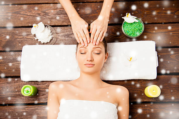 istock Young woman having spa procedures, xmas concept 615489248