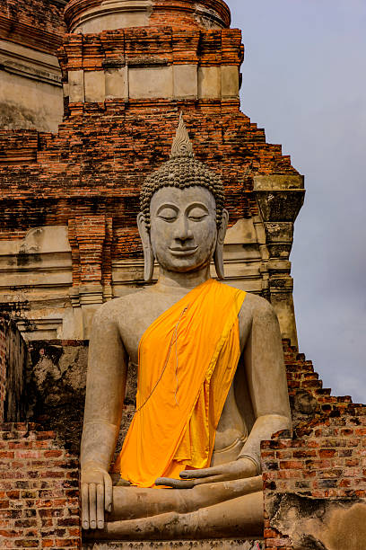 istock Ancient buddha statue with old pagoda, 615489482