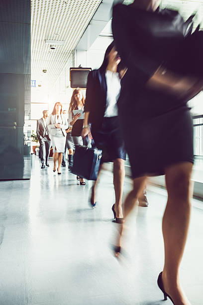 istock Business People Walking Through the Corridor 615489602