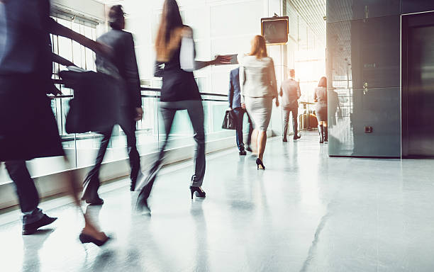 istock Business People Walking Through the Corridor 615489614