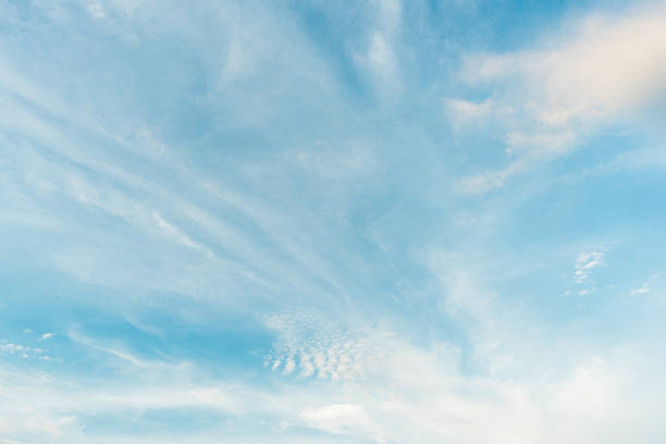 istock blue sky background and clouds in daylight time 615490578