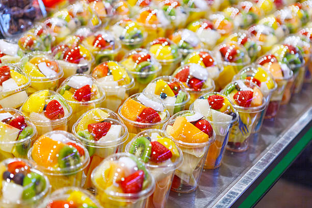 istock Fruit Salad arranged in plastic cups on a market 615491316