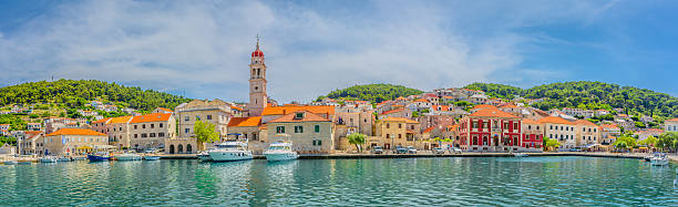 Panorama mediterranean town Croatia. View at Pucisca mediterranean town in Island Brac, Croatia panorama. old catholic church on island brac croatia stock pictures, royalty-free photos & images