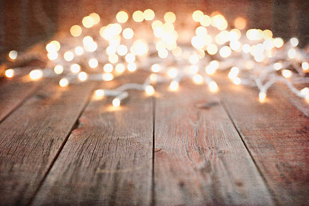 istock Environmentally Friendly Christmas Lights Old Wood Background 615492124
