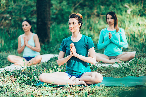 istock Yoga class. Group of women practicing yoga 615492544