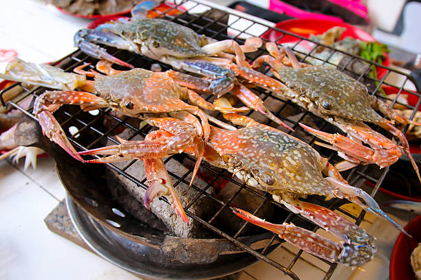 istock grilling  seafood on charcoal grill 615494554
