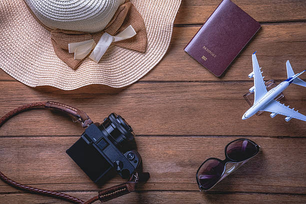 istock Travel accessories and costume on table 615496460